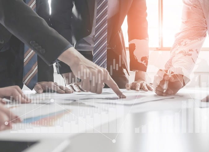 People working with charts and info.